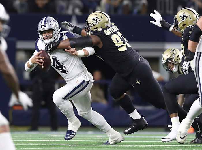 Dallas quarterback Dak Prescott (4) is sacked by New Orleans Saints defensive tackle David Onyemata (93). Mandatory Credit: Matthew Emmons-USA TODAY Sports